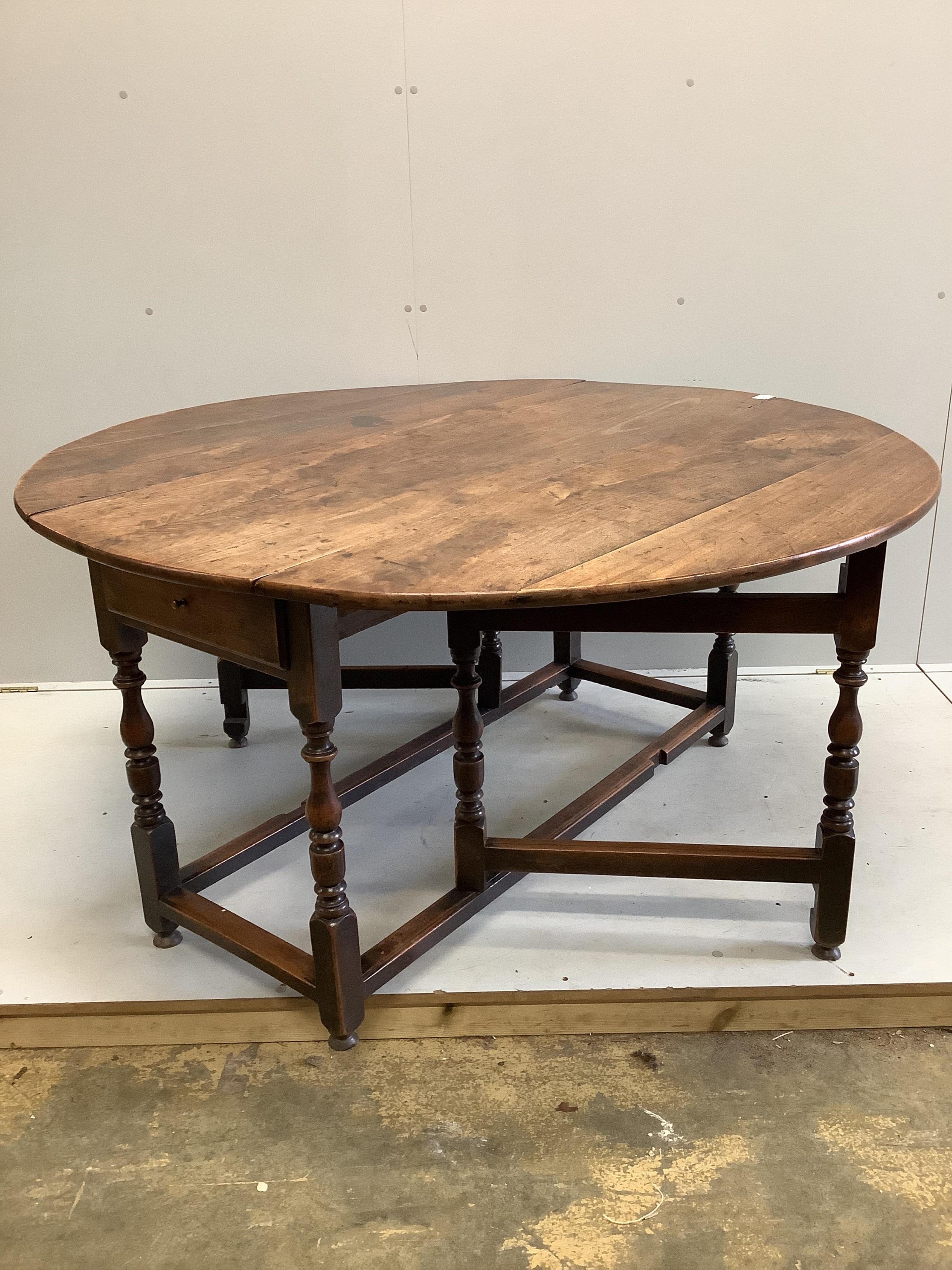 An 18th century mahogany gateleg dining table, 145cm extended, depth 144cm, height 74cm. Condition - fair to good